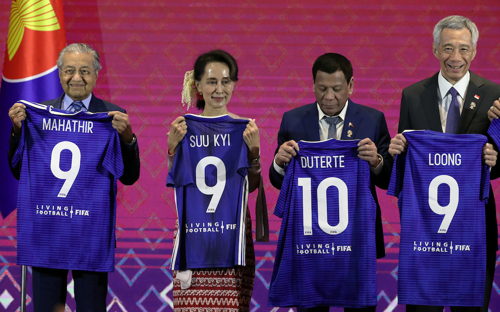 Asean leaders pose with t-shirts at a signing ceremony of the Memorandum of Understanding between Asean and Fifa, in Bangkok November 2, 2019. u00e2u20acu201d Reuters pic