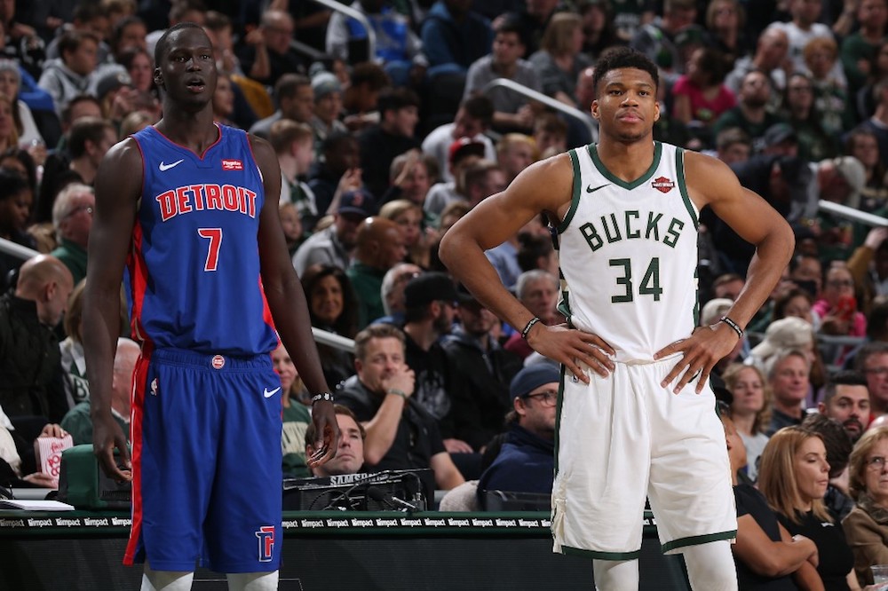 Thon Maker of the Detroit Pistons and Giannis Antetokounmpo of the Milwaukee Bucks look on during a game at the Fiserv Forum Centre in Milwaukee November 23, 2019. u00e2u20acu201d AFP pic