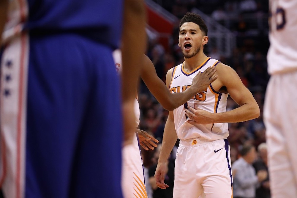 Devin Booker of the Phoenix Suns reacts as he awaits a free-throw shot against the Philadelphia 76ers during the second half of the NBA game at Talking Stick Resort Arena in Phoenix, Arizona November 4, 2019. u00e2u20acu201d AFP pic