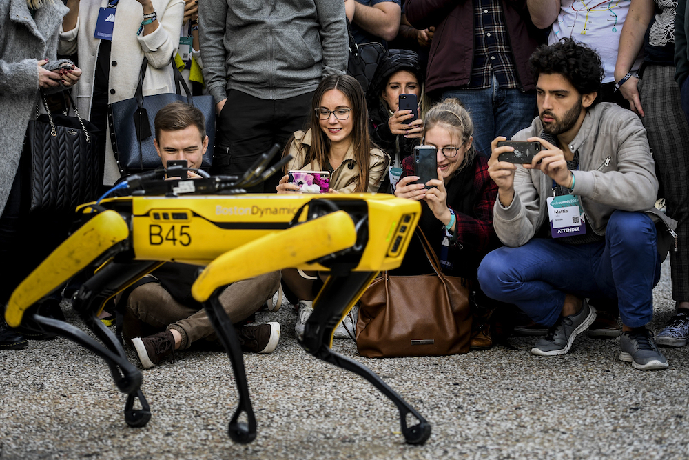 People take pictures and videos of Boston Dynamics Robot Dog named u00e2u20acu02dcSpotu00e2u20acu2122 during a presentation on the last day of the Web Summit in Lisbon. u00e2u20acu201d AFP pic