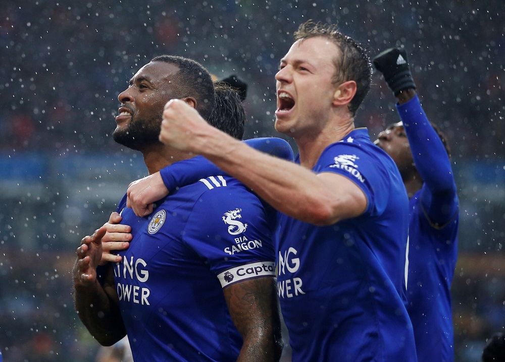Leicester Cityu00e2u20acu2122s Wes Morgan celebrates scoring their second goal with Jonny Evans and team mates at Turf Moor in Burnley March 16, 2019. u00e2u20acu201d Action Images via Reuters