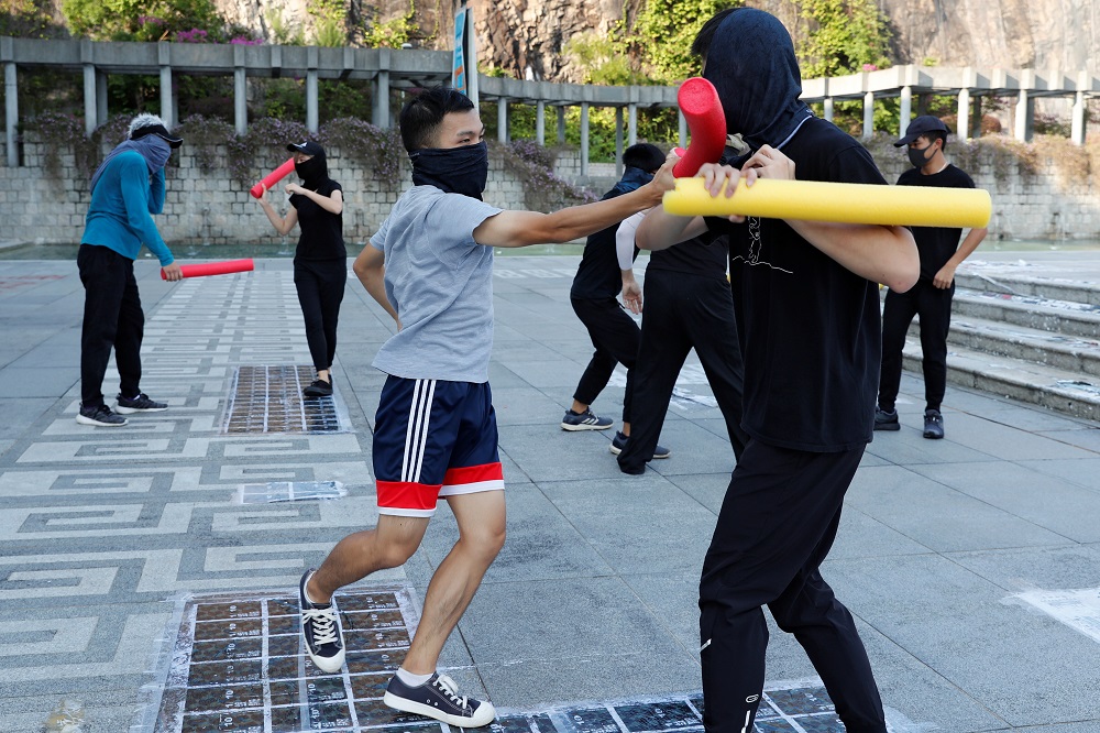 Masked participants spar with foam sticks during a self-defence class organised by a student union at the Chinese University of Hong Kong October 15, 2019. u00e2u20acu201d Reuters pic