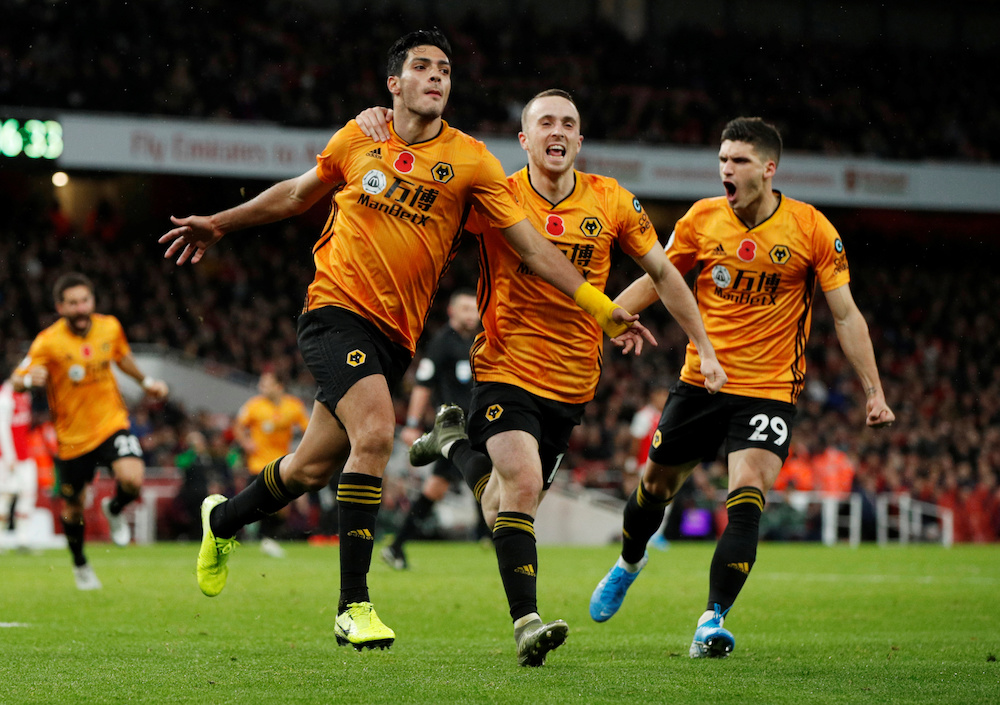 Wolverhampton Wanderersu00e2u20acu2122 Raul Jimenez celebrates scoring their first goal with Diogo Jota and Ruben Vinagre during the Premier League match with Arsenal at Emirates Stadium in London November 2, 2019. u00e2u20acu201d Action Images pic via Reuters
