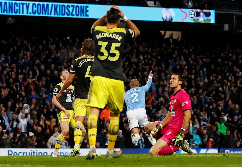 Manchester Cityu00e2u20acu2122s Kyle Walker celebrates scoring their second goal as Southamptonu00e2u20acu2122s Alex McCarthy and Jan Bednarek look dejected during their Premier League at Etihad Stadium in Manchester November 2, 2019. u00e2u20acu201d Action Images pic via Reuters