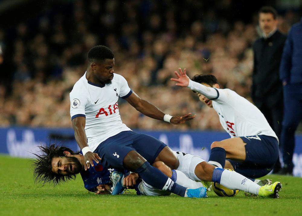 Evertonu00e2u20acu2122s Andre Gomes sustains an injury in action with Tottenham Hotspuru00e2u20acu2122s Serge Aurier and Son Heung-min during their Premier League match at Goodison Park in Liverpool November 3, 2019. u00e2u20acu201d Action Images pic via Reuters