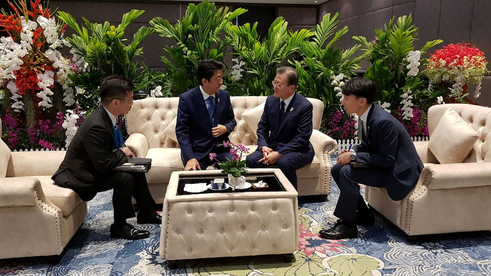 South Korean President Moon Jae-in talks with Japanese Prime Minister Shinzo Abe during their bilateral meeting in Bangkok November 4, 2019. u00e2u20acu201d Reuters pic