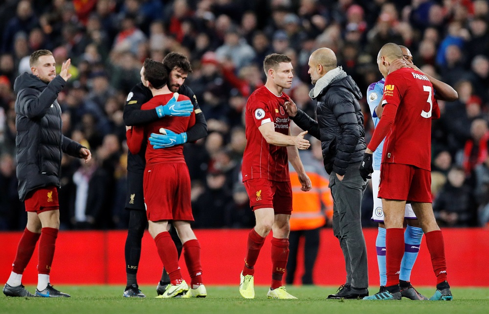 Manchester City manager Pep Guardiola with Liverpoolu00e2u20acu2122s James Milner after the match at Anfield, Liverpool November 10, 2019. u00e2u20acu201d Reuters pic