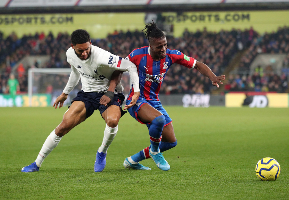 Crystal Palace’s Wilfried Zaha in action with Liverpool’s Joe Gomez during their Premier League match at Selhurst Park in London November 23, 2019. — Reuters pic
