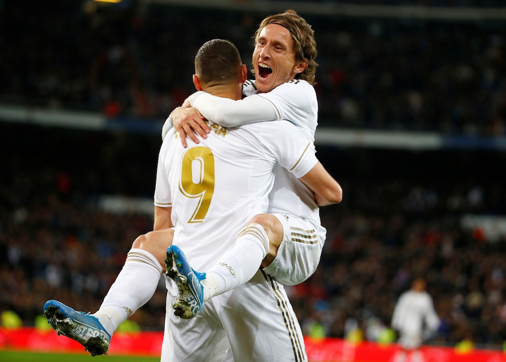 Real Madridu00e2u20acu2122s Luka Modric celebrates scoring their third goal with Karim Benzema during the La Liga match with Real Sociedad at Santiago Bernabeu in Madrid November 23, 2019. u00e2u20acu201d Reuters pic
