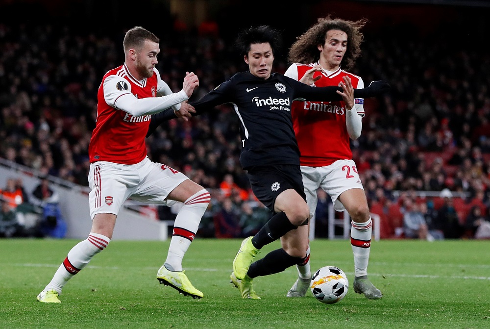 Eintracht Frankfurtu00e2u20acu2122s Daichi Kamada in action with Arsenalu00e2u20acu2122s Matteo Guendouzi at the Emirates Stadium in London November 28, 2019. u00e2u20acu201d Action Images via Reuters