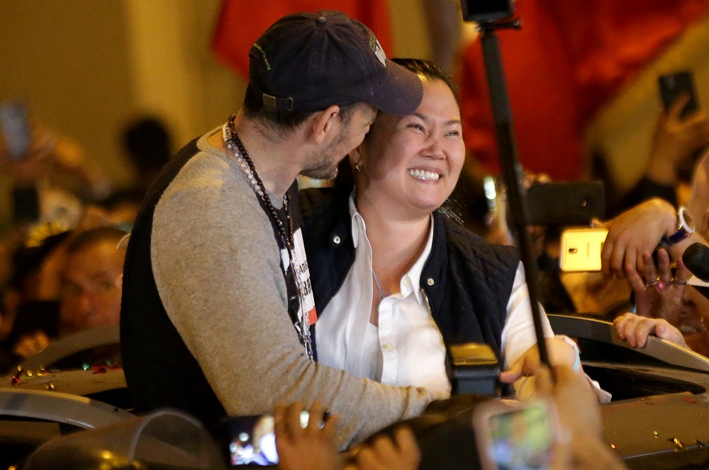 Peru's opposition leader Keiko Fujimori embraces her husband Mark Vito Villanella after she was released from the Santa Monica prison, in Lima November 29, 2019. u00e2u20acu201d Reuters pic