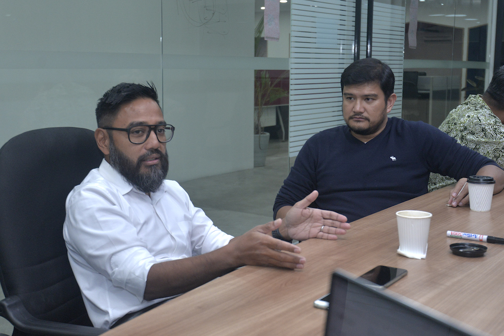 AirAsia X chief executive officer, Benyamin Ismail, and AirAsia Bhd chief executive officer, Riad Asmat, during a visit to Malay Mail offices in Petaling Jaya October 31, 2019. u00e2u20acu201d Picture by Shafwan Zaidon