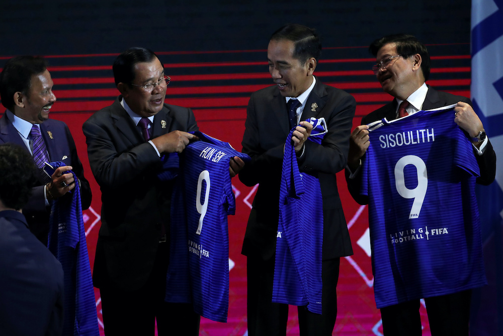 Asean leaders pose with t-shirts at a signing ceremony of the Memorandum of Understanding between Asean and FIFA, in Bangkok November 2, 2019. u00e2u20acu201d Reuters pic