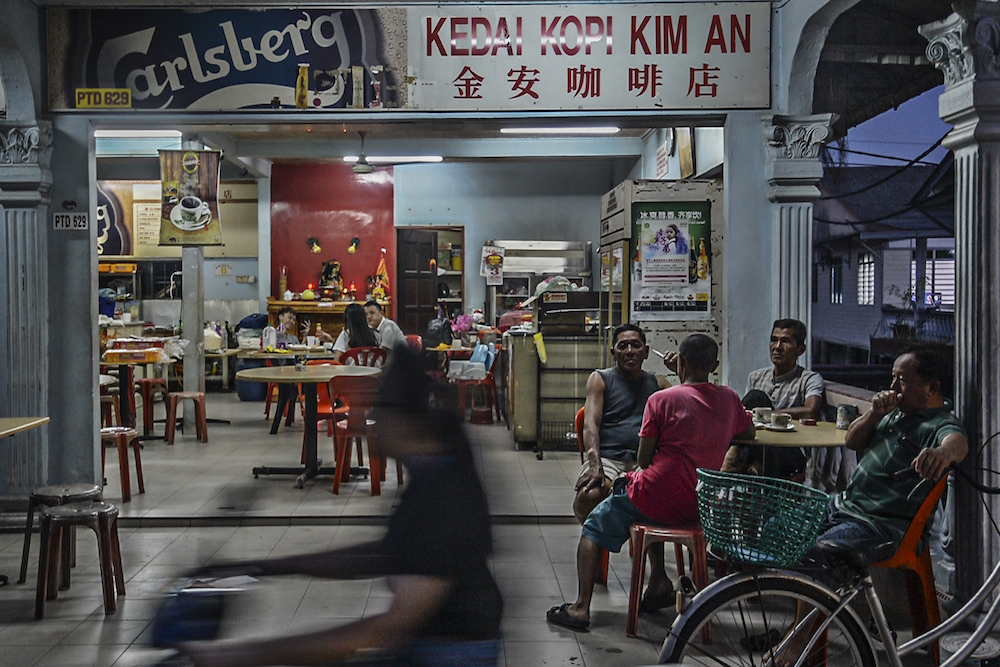 Senior citizens chat in a coffee shop in Kampung Kukup Laut in Kukup, Pontian November 3, 2019. u00e2u20acu201d Picture by Shafwan Zaidon