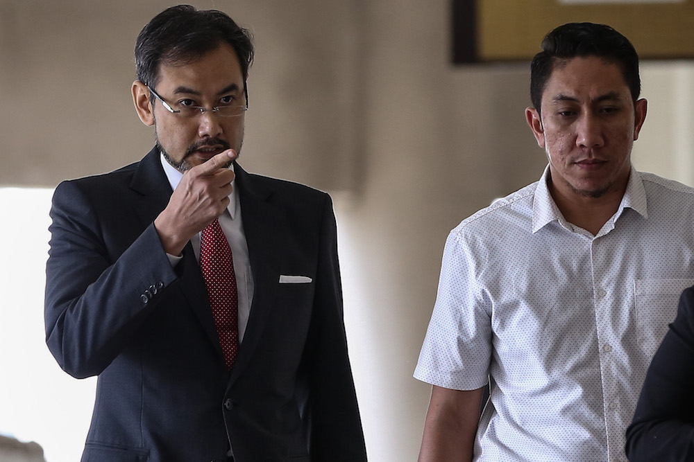 Former 1MDB chief executive officer Datuk Shahrol Azral Ibrahim Halmi (left) arrives at the Kuala Lumpur Courts Complex November 4, 2019. u00e2u20acu201d Picture by Yusof Mat Isa