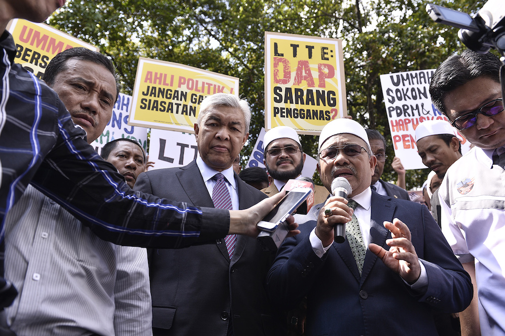 Tuan Haji Ibrahim Tuan Man speaks during a Gerakan Pembela Ummah demonstration in front of Parliament November 5, 2019. — Picture by Miera Zulyana