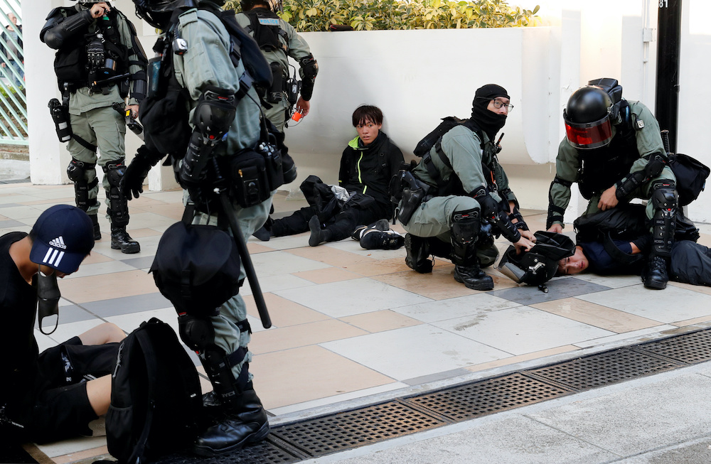 Protesters are detained by riot police officers during an anti-government demonstration in Hong Kong November 10, 2019. u00e2u20acu201d Reuters pic