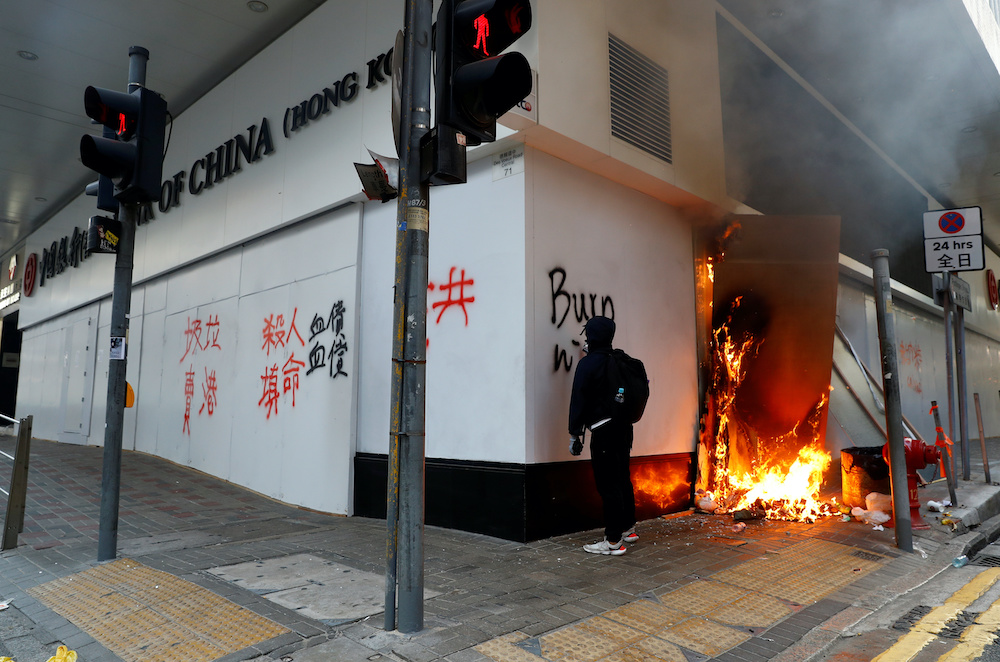 A protester writes on the wall of a Bank of China branch during a demonstration in Central, Hong Kong November 11, 2019. u00e2u20acu201d Reuters pic