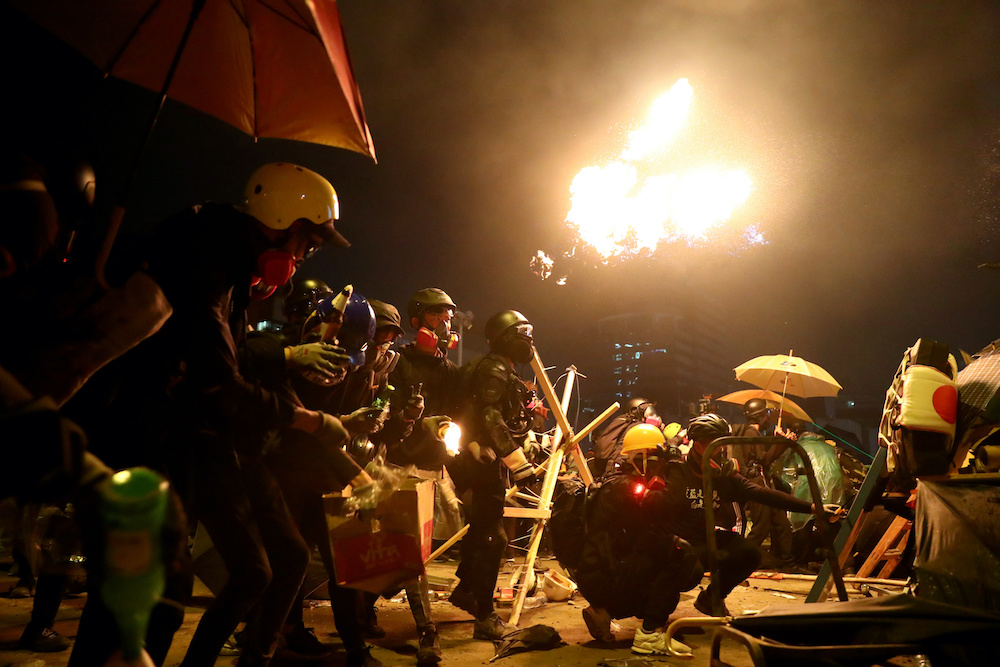 Anti-government protesters prepare molotov cocktails during clashes with police, outside Hong Kong Polytechnic University (PolyU) in Hong Kong November 17, 2019. u00e2u20acu201d Reuters pic