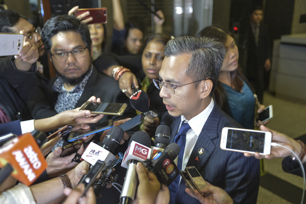 PKR communications chief Fahmi Fadzil speaks to reporters at the Parliament building after the PKR politic bureau meeting  in Kuala Lumpur November 20, 2019. u00e2u20acu201d Picture by Shafwan Zaidon