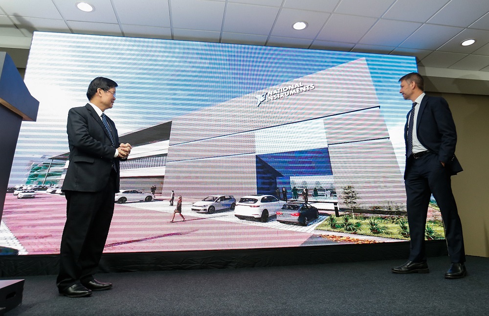 Penang Chief Minister Chow Kon Yeow (left) and National Instruments president and COO Eric Starkloff (right) viewing a montage during the official site opening of the companyu00e2u20acu2122s new expanded unit in Batu Maung November 21, 2019. u00e2u20acu201d Picture by Sayuti Zai