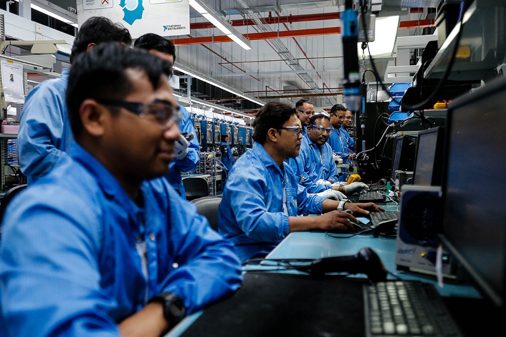 Workers are pictured at their respective stations at a factory in Batu Maung November 22, 2019. u00e2u20acu201d Picture by Sayuti Zainudin