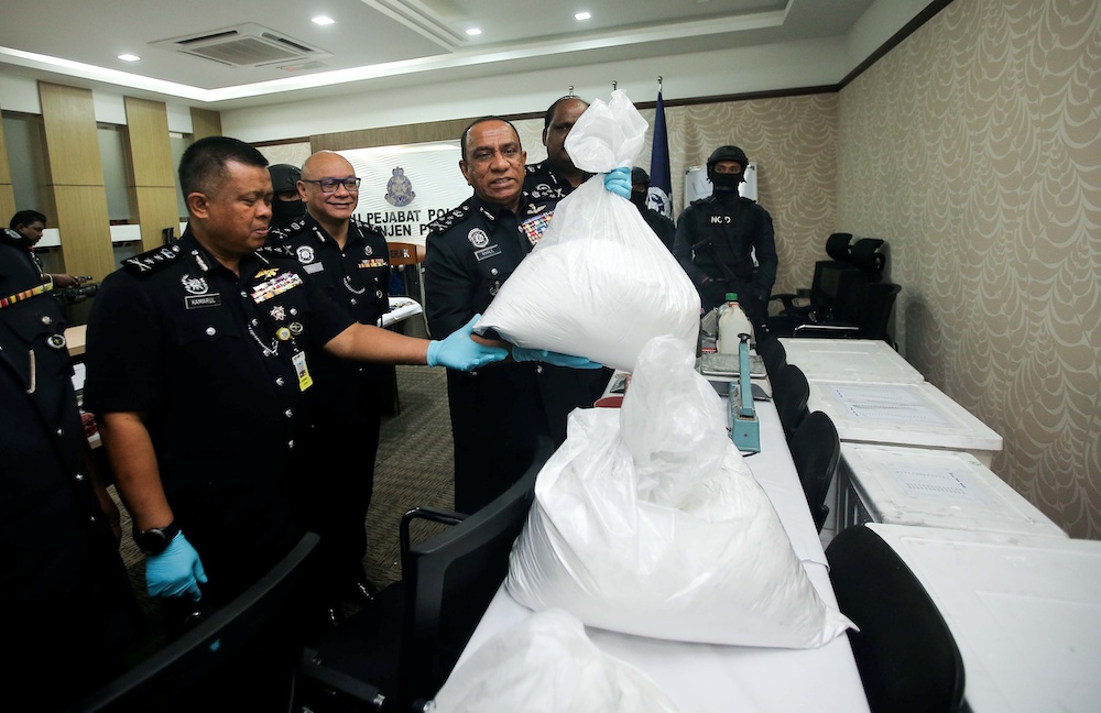 Bukit Aman Narcotics Crime Investigation Department (NCID) director Commissioner Datuk Mohd Khalil Kader Mohd showing the seized drugs at the Perak Police Headquarters in Ipoh, November 25, 2019. u00e2u20acu201d Picture by Farhan Najib