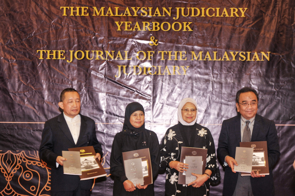 (From left) Tan Sri Idrus Harun, Malaysia Chief Justice Tan Sri Tengku Mainun Tuan Man, Datuk Rohana Yusuf and Tan Sri Azhar Mohamed at the launch of the Judicial Year Book 2018 in Putrajaya November 27, 2019. u00e2u20acu201d Picture by Shafwan Zaidon
