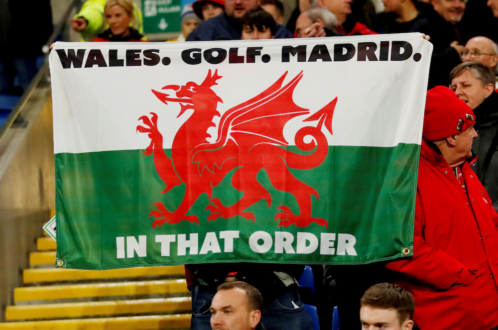 Fans display a Wales flag in reference to Gareth Bale before the match in Cardiff November 29, 2019. u00e2u20acu201d Action Images via Reuters