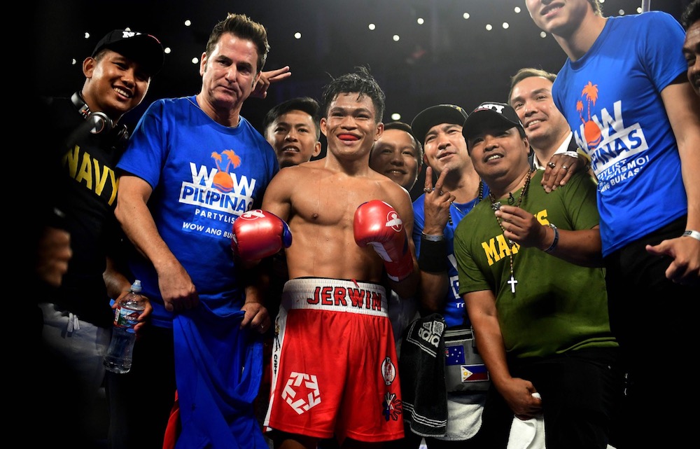 Jerwin Ancajas of the Philippines and his team pose for pictures after defeating Ryuichi Funai of Japan during their 12-round Super Flyweight IBF World Title fight in Stockton, California May 4, 2019. u00e2u20acu201d AFP pic