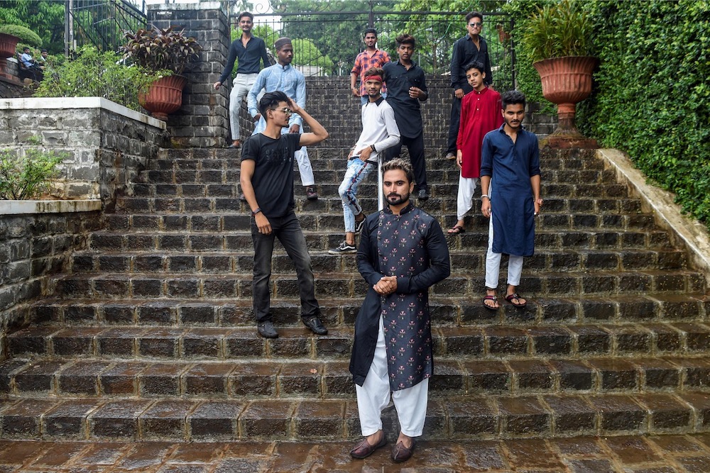 Mentor Akhtar Shaikh (front centre) poses with his friends after recording a video for the video-sharing app TikTok, in Mumbai November 10, 2019. — AFP pic