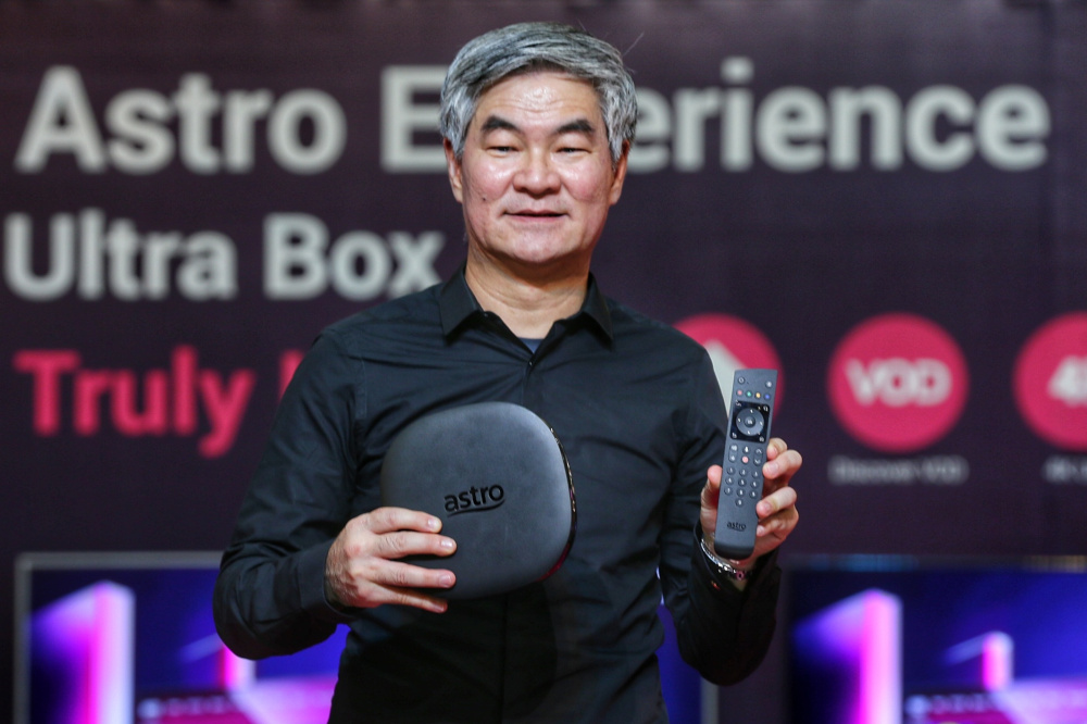 Astro Group’s chief executive officer Henry Tan showing off the new Ultra Box and its accompanying remote control. — Picture by Ahmad Zamzahuri