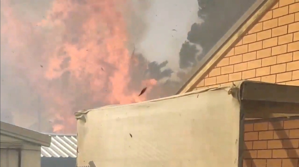 A fire blazes behind a house in Paradise City, Adelaide, southern Australia, November 20, 2019, in this still image obtained from a social media video. u00e2u20acu201d Picture courtesy of Chirag Thakkar/social media via Reuters 