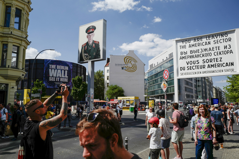 Tourists crowd Checkpoint Charlie, a former checkpoint connecting the former US sector with the Soviet sector in then divided Berlin. u00e2u20acu201d AFP pic