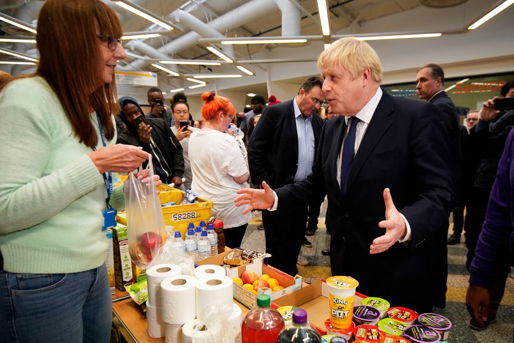 Britain’s Prime Minister Boris Johnson speaks to staff and students as he visits the University of Bolton, after a large fire broke out at a student accommodation, November 16, 2019. — Christopher Furlong/Pool picture via Reuters