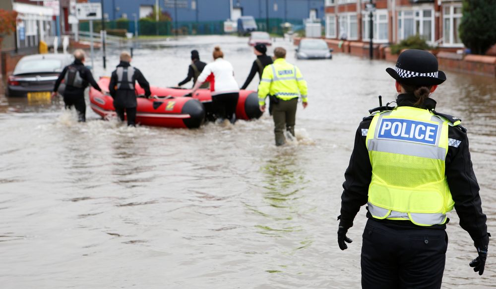 A police officer looks at a rescue boat on a flooded street in Bentley, north of Doncaster, Britain November 8, 2019. u00e2u20acu201d Reuters pic