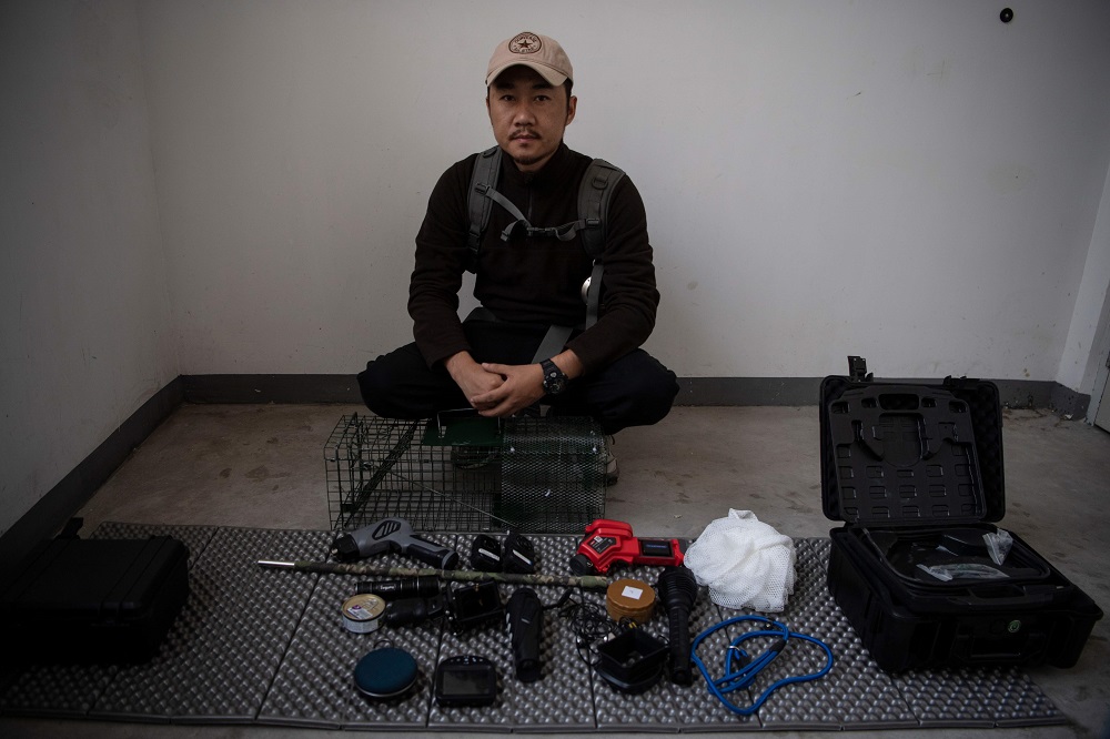 This photo taken on October 23, 2019 shows pet detective Sun Jinrong sitting next to his equipment as he prepares to search for a missing cat in a residential compound in Beijing. u00e2u20acu201d AFP pic  
