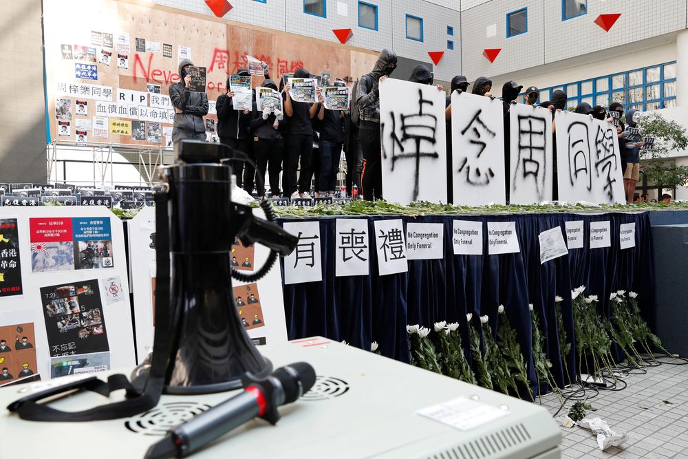 Students attend a ceremony to pay tribute to Chow Tsz-lok, 22, a student who fell during protests at the weekend and died on Friday morning, at the Hong Kong University of Science and Technology, in Hong Kong, China November 8, 2019. u00e2u20acu201d Reuter pic