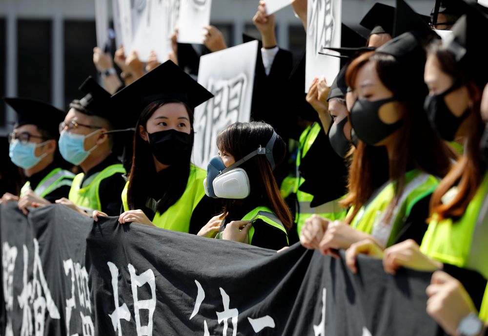 Graduates wearing masks hold an anti-government rally after their graduation ceremony at the Chinese University of Hong Kong in Hong Kong, China, November 7, 2019. u00e2u20acu201d Reuters pic