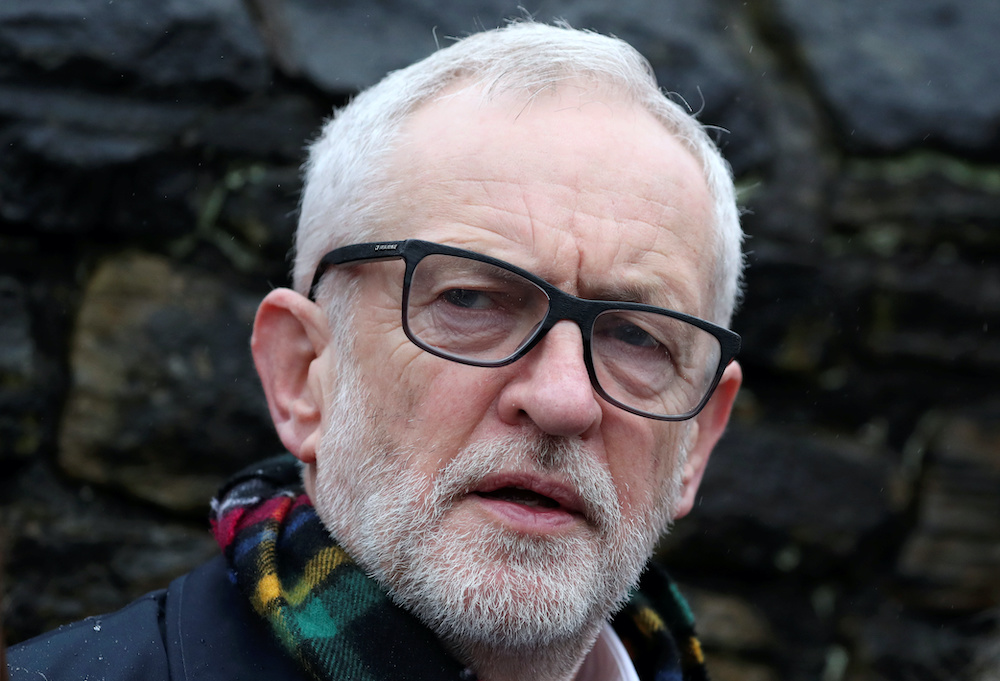 Britainu00e2u20acu2122s Labour Party leader Jeremy Corbyn stands outside Amazonu00e2u20acu2122s depot in Sheffield, Britain, November 23, 2019. u00e2u20acu201d Reuters picnn