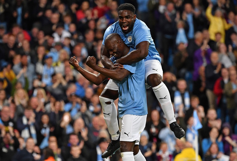 Manchester City Legend's Benjani (left) celebrates scoring his team's second goal with English defender Micah Richards at the Etihad Stadium in Manchester September 11, 2019. u00e2u20acu201d AFP pic