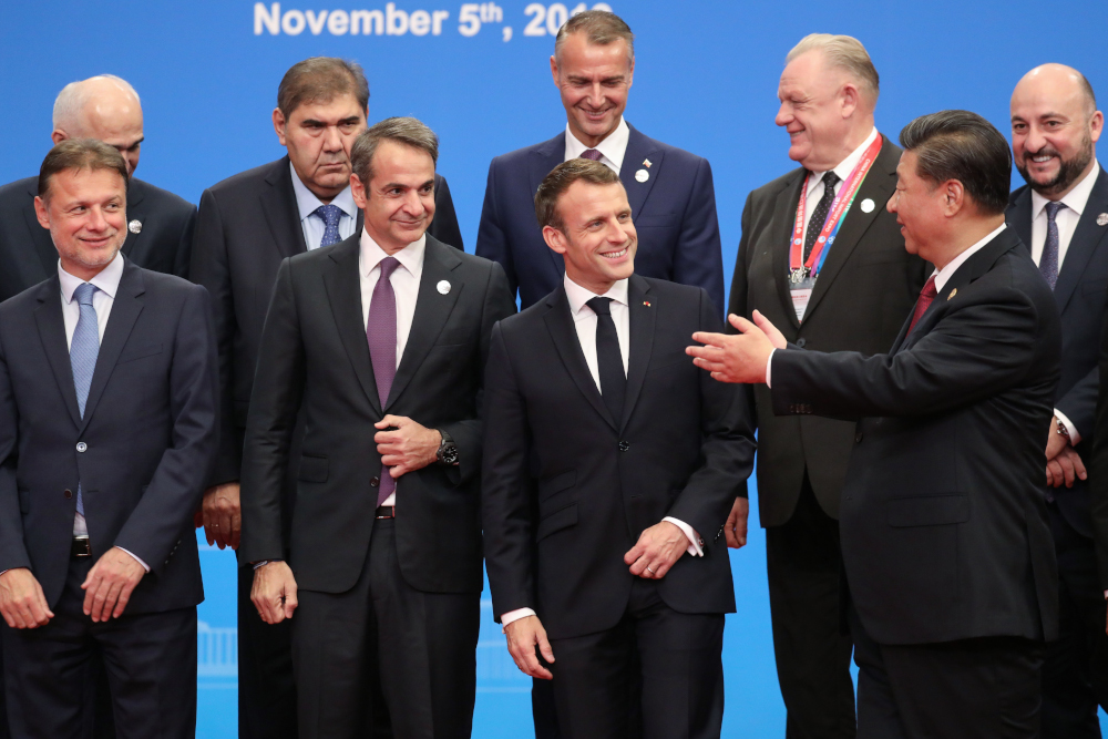 Chinau00e2u20acu2122s President Xi Jinping gestures to French President Emmanuel Macron (centre) during the China International Import Expo in Shanghai November 5, 2019. u00e2u20acu201d AFP pic
