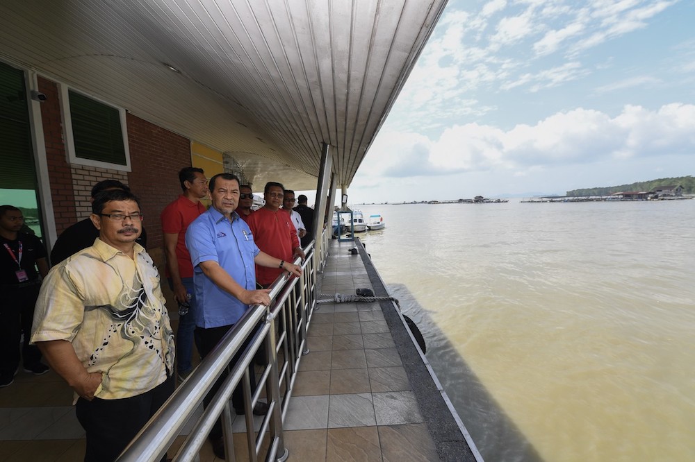 State Public Works, Transport and Infrastructure Committee chairman Mohd Solihan Badri (blue shirt) visits Kukup International Ferry Terminal November 1, 2019. u00e2u20acu201d Bernama pic