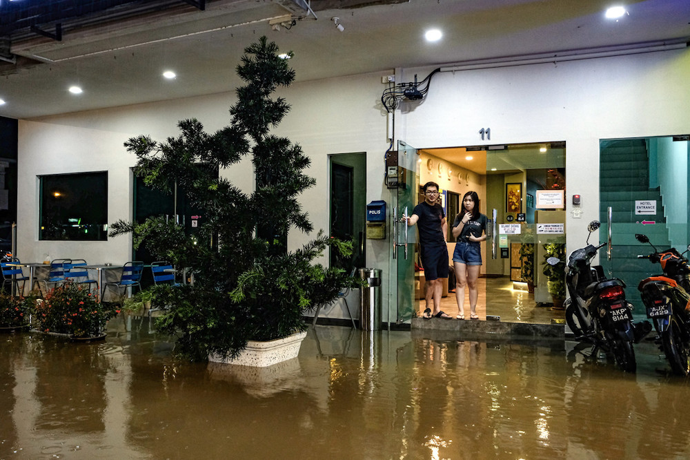 Guests look out of the door of their hotel in Ipoh November 1, 2019. u00e2u20acu201d Bernama pic