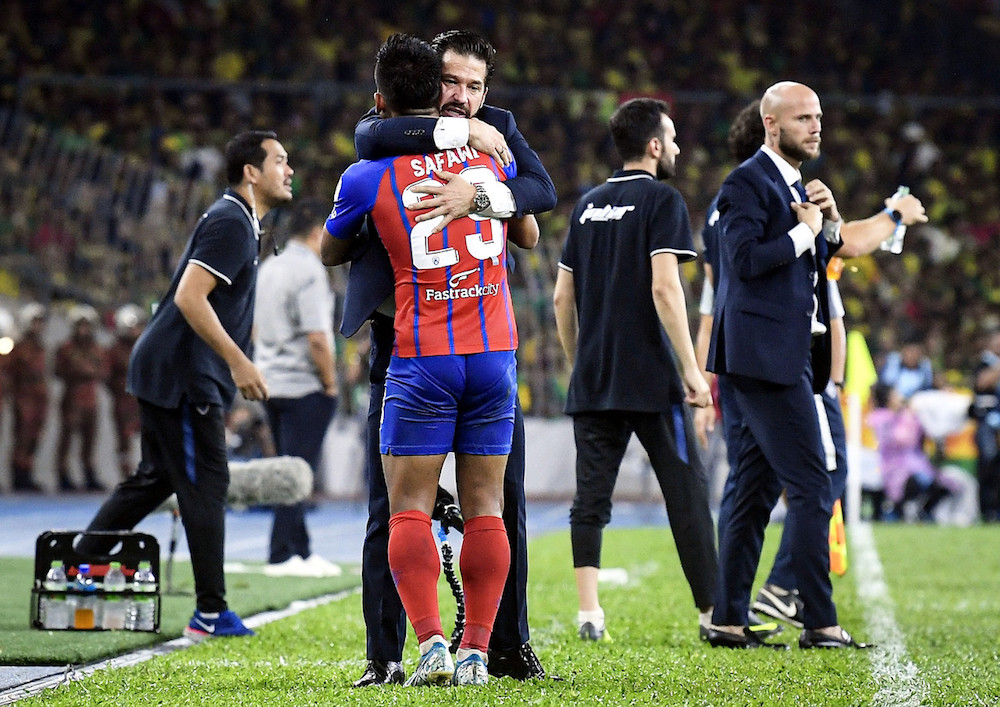 Johor Darul Tau00e2u20acu2122zim (JDT) head coach Benjamin Mora celebrates with Muhammad Safawi Rasid after he scored the teamu00e2u20acu2122s second goal during the Malaysia Cup final with Kedah at Bukit Jalil National Staidum in Kuala Lumpur November 2, 2019. u00e2u20acu201d Bernama pic