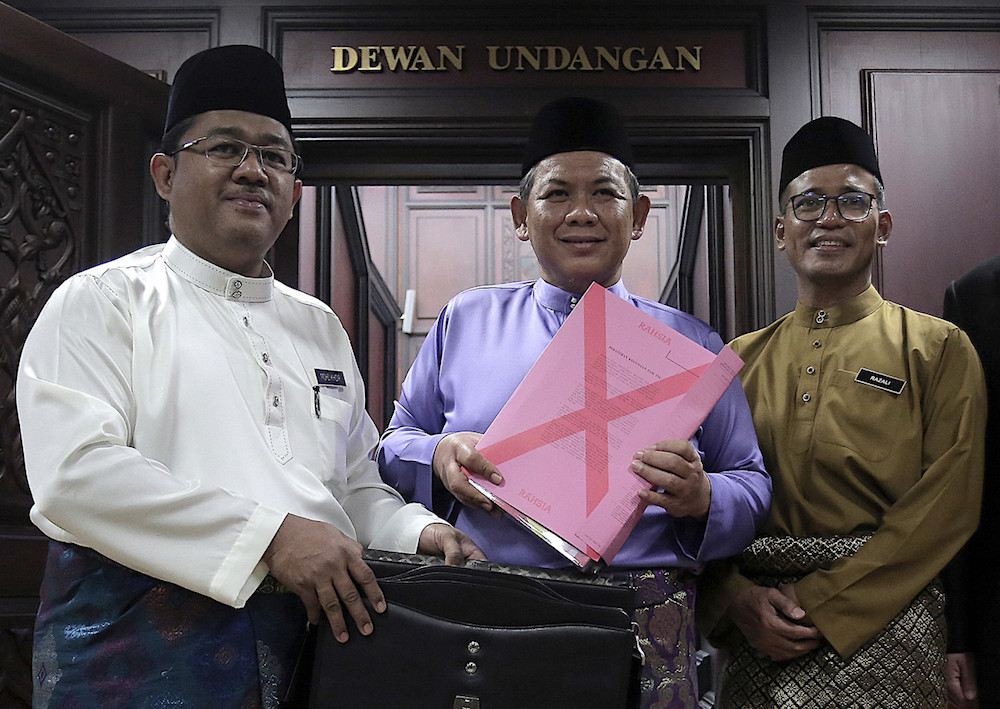 Mentri Besar Datuk Seri Aminuddin Harun holds a copy of the Negri Sembilan Budget for 2020 at the state legislative assembly in Seremban November 22, 2019. u00e2u20acu201d Bernama pic