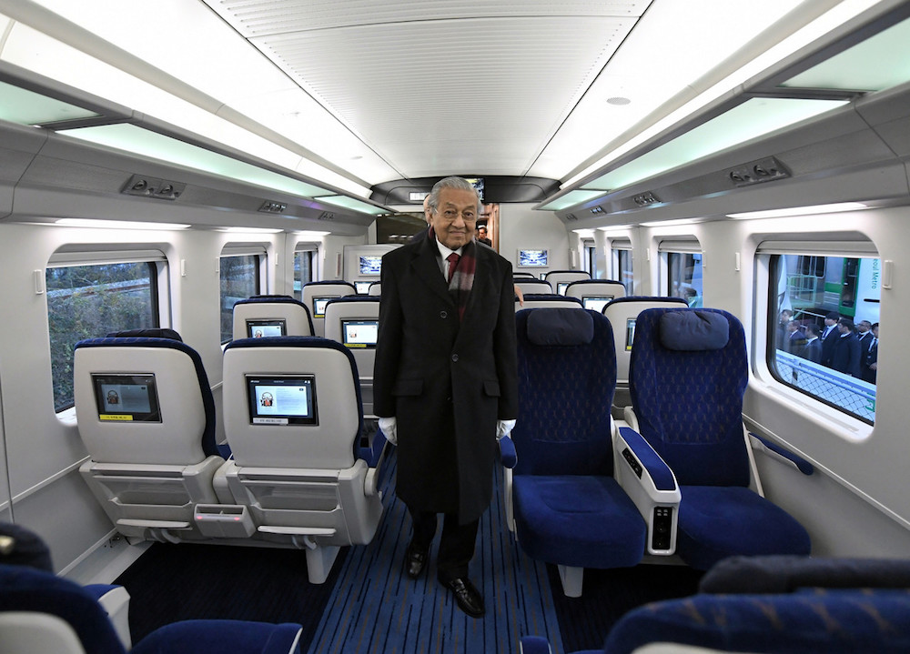 Prime Minister Tun Dr Mahathir Mohamad boards a train during a visit to Hyundai Rotem in Busan November 26, 2019. u00e2u20acu201d Bernama pic