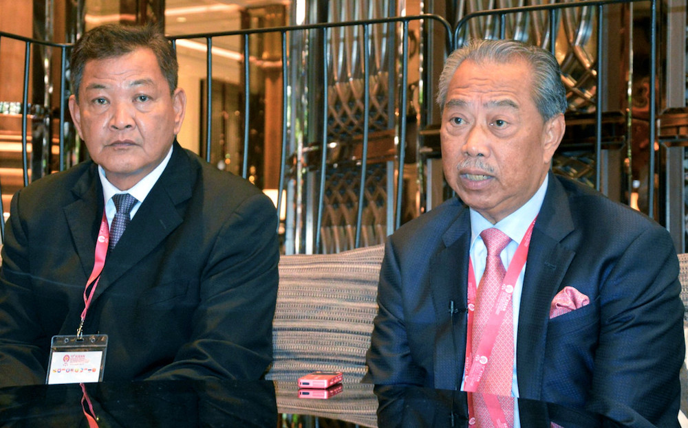 IGP Tan Sri Abdul Hamid Bador and Home Minister Tan Sri Muhyiddin Yassin speak to reporters in Bangkok November 28, 2019. u00e2u20acu201d Bernama pic