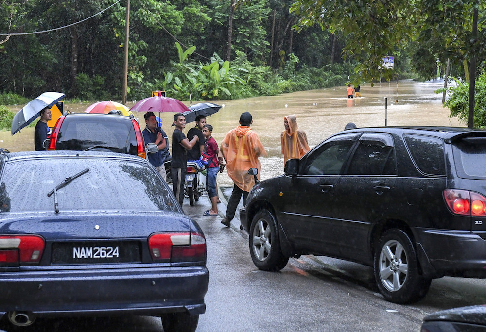 Residents are stranded after floodwater cuts them off from their homes in Kampung Chenulang in Kuala Krai November 29, 2019. u00e2u20acu201d Bernama pic