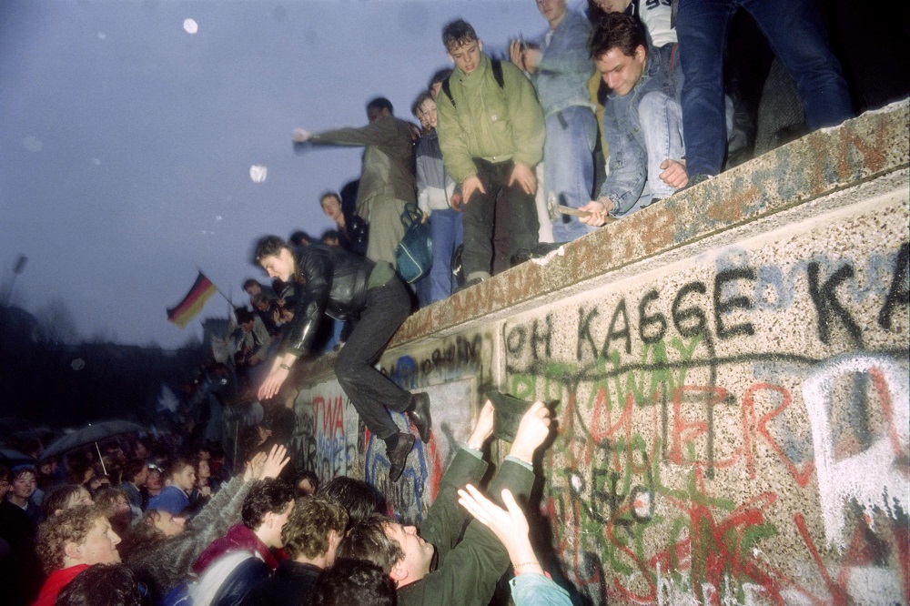 In this file photo taken on December 22, 1989, people from East Germany greet citizens of West Germany at the Brandenburg Gate in Berlin. u00e2u20acu201d AFP pic           